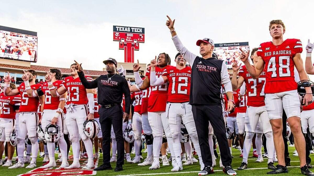 LUBBOCK, TEXAS - OCTOBER 25: Head Coach Joey McGuire of the Texas Tech Red Raiders stands with his players for "The Matador Song" after the game against the Oklahoma State Cowboys at Jones AT&T Stadium on October 25, 2025 in Lubbock, Texas. (Photo by John E. Moore III/Getty Images)