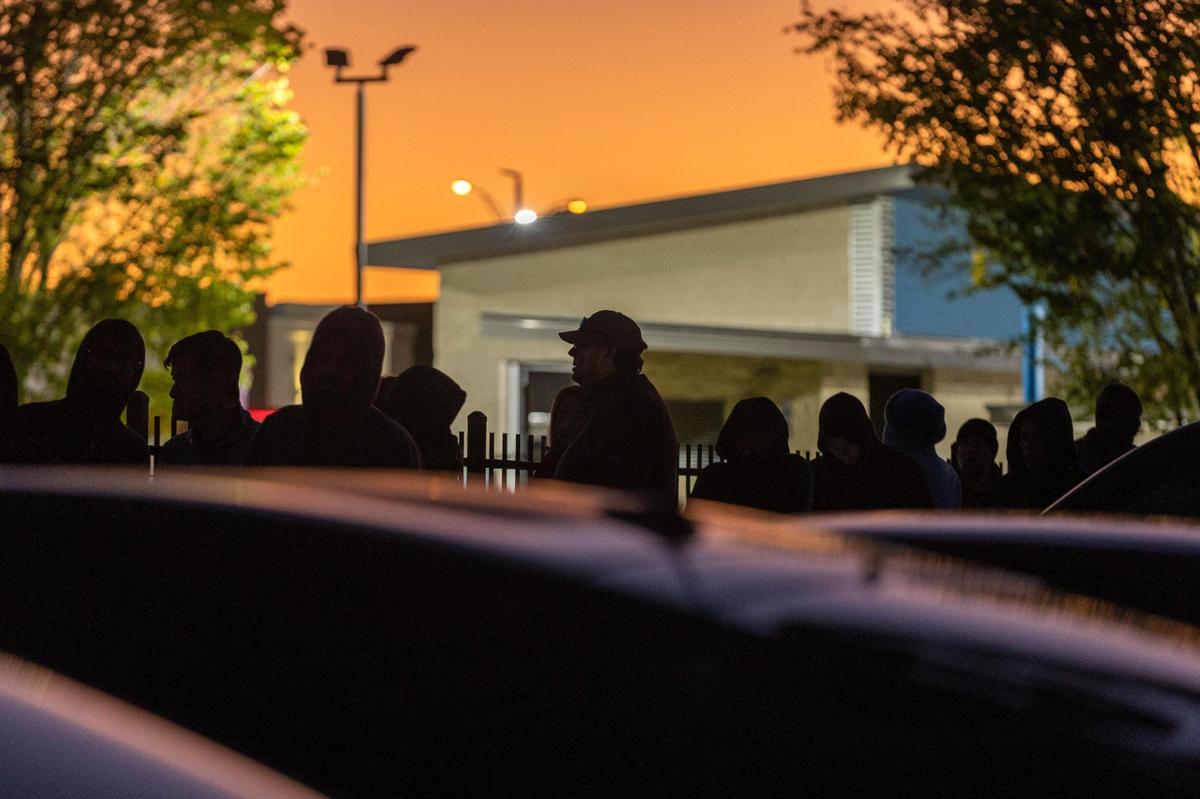 People line up hours before the office opens for a walk-in appointment at the Texas Department of Public Safety Driver License Mega Center in Fort Worth on Tuesday, Oct. 18, 2022.