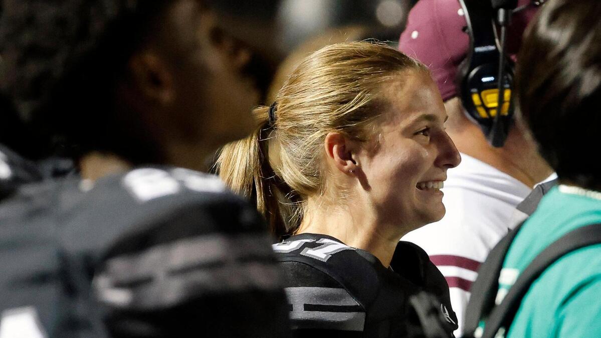 Timberview kicker Emma Young (87) watches the game from the sidelines in the second half of a UIL football game at Vernon Newsom Stadium in Mansfield, Texas, Thursday, Oct. 19, 2023.