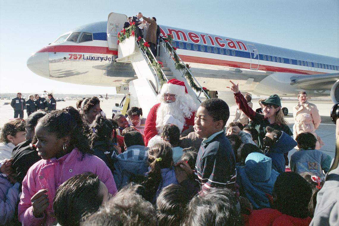 Dec. 14, 1989: Inauguration ceremonies for the new $35 million Alliance Airport in Fort Worth attracted a crowd of more than 300 spectators. Santa, the first passenger to arrive at the airport on an American Airlines 757 jet, greets elementary school students after exiting the plane.