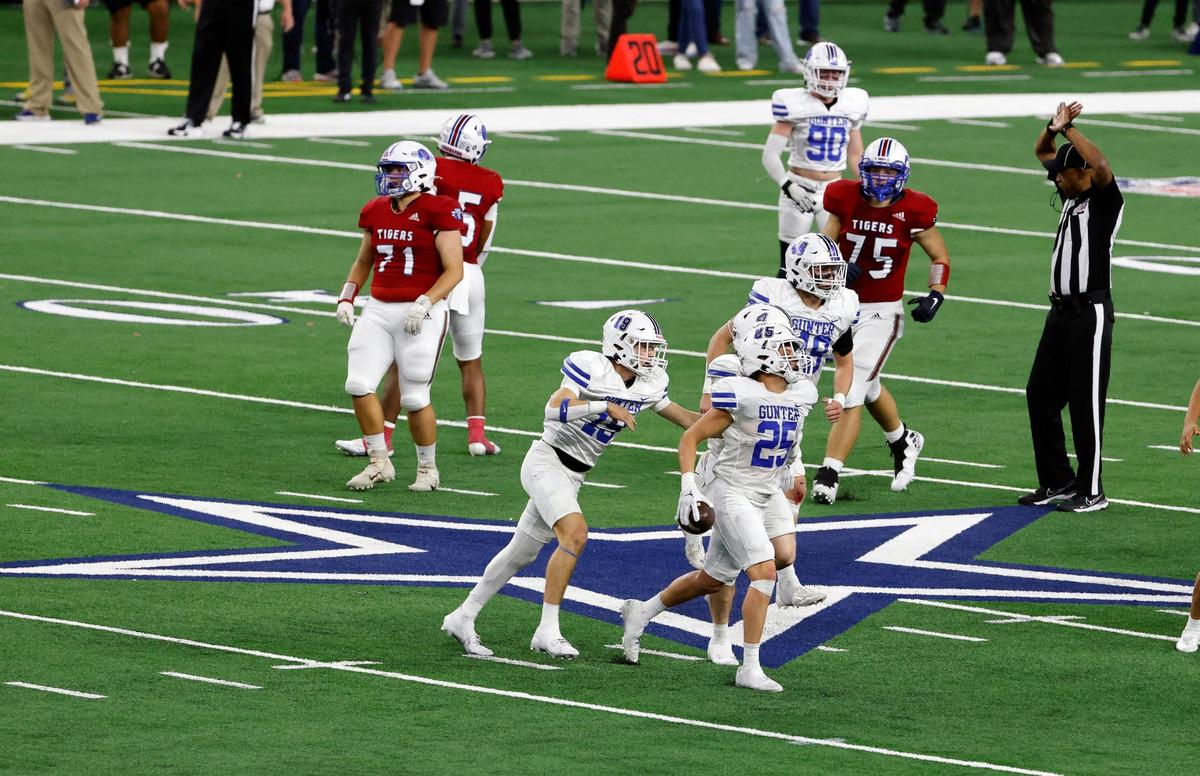 Gunter middle linebacker Marshall Magers intercepts a Tidehaven pass during the first half of the UIL Conference 3A Division 2 state championship football game at AT&T Stadium in Arlington, Texas, Thursday, Dec. 14, 2023.