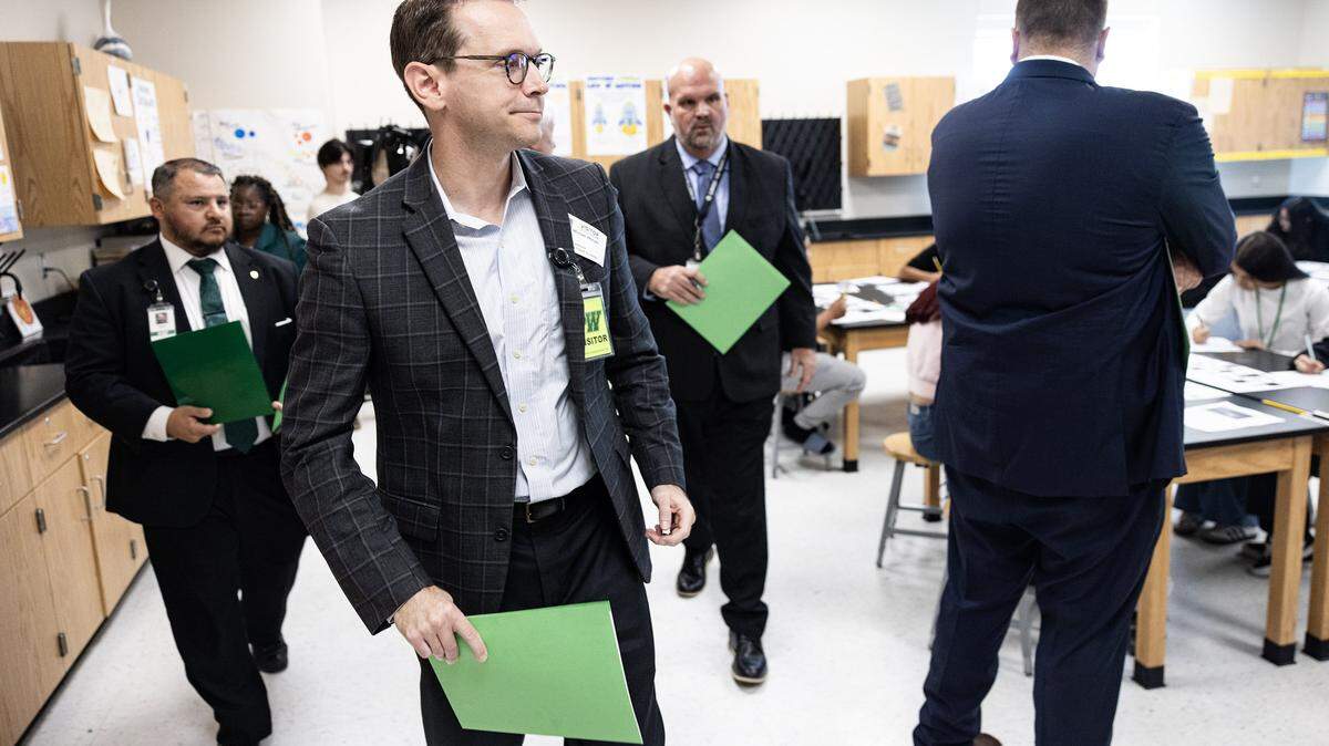 Mike Morath, the Texas Commissioner of Education, walks through a science class at Lucyle Collins Middle School in Lake Worth on Tuesday, Oct. 21, 2025. 