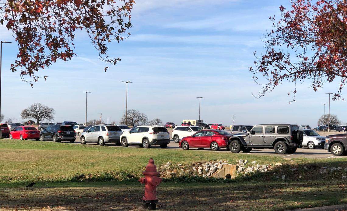When appointments officially started at 10 a.m. Tuesday, Dec. 28, 2021, at the TCC Northeast Campus COVID-19 testing site, the line was over 70 cars long, winding through multiple parking lots and up the street.