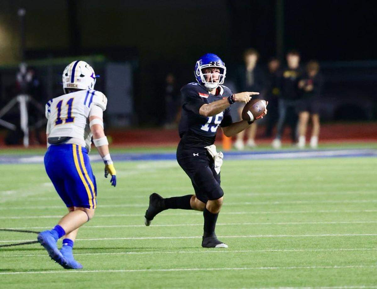Graham quarterback Ty Thompson (15) looks for a receiver down field as Brock’s Tyler Kirk (11) pursues on Friday, Nov. 1, 2024 at Newton Field in Graham, Texas.