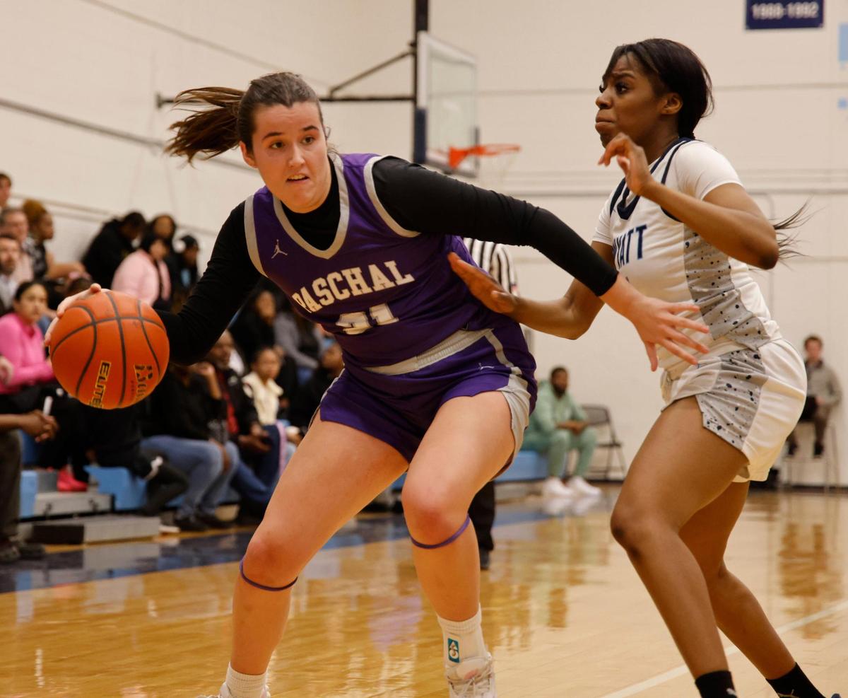 Paschal forward Amelia Robbins (21) maneuvers around O.D. Wyatt guard Gavyn Henderson (5) during a UIL girls basketball game at O.D. Wyatt High School in Fort Worth, Texas, Friday, Jan. 24, 2025.
