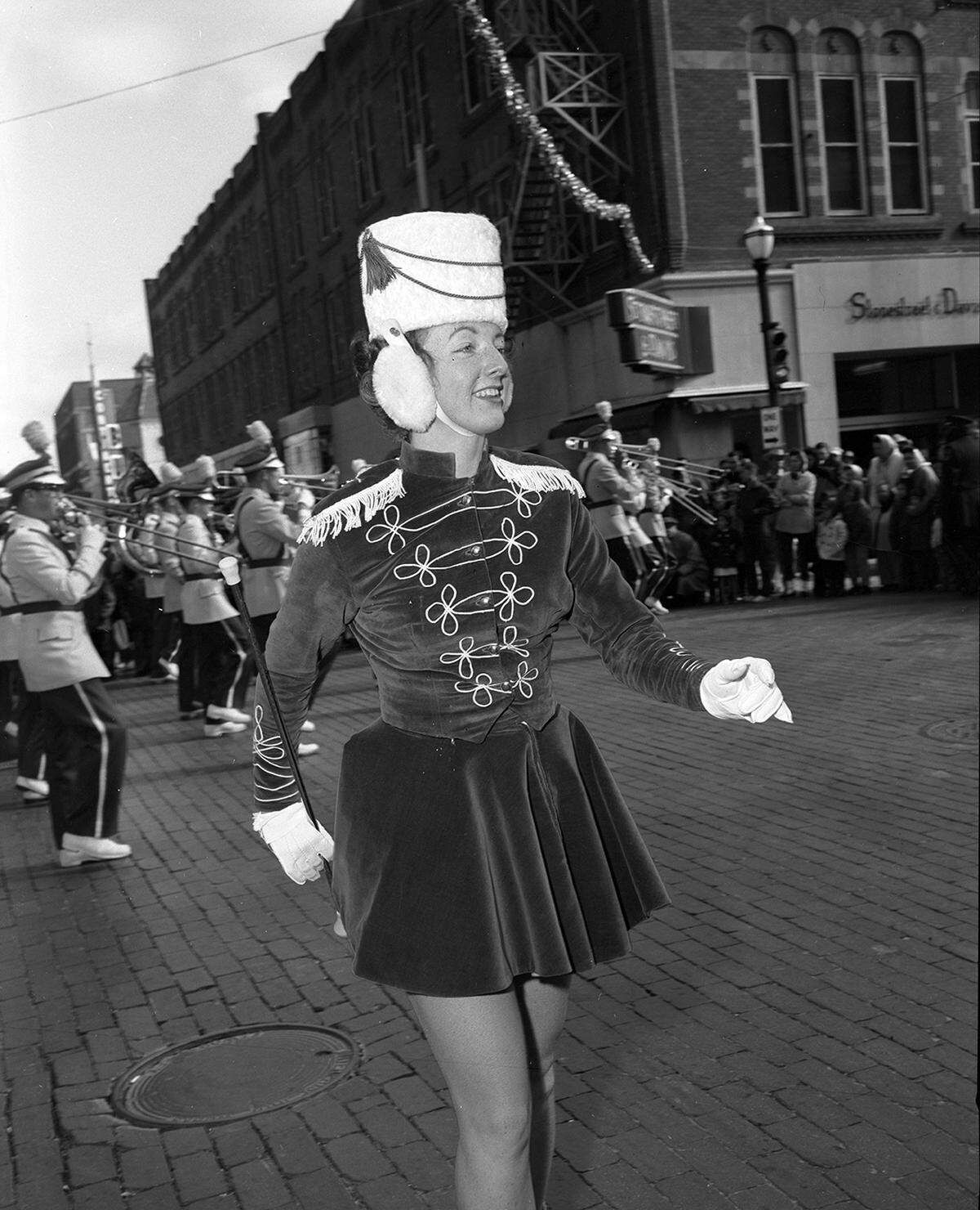 Nov. 28, 1958: Majorette Kaye Rogers, 16, daughter of Mr. and Mrs. W.L. Rogers, steps out with the Paschal High School band, smiling at chilling guests at Fort Worth’s Christmas Parade.
