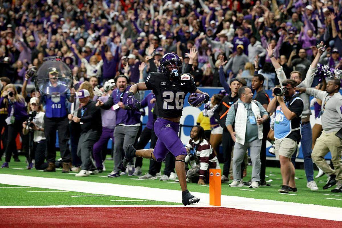 SAN ANTONIO, TEXAS - DECEMBER 30: Jeremy Payne #26 of the TCU Horned Frogs scores the final touchdown of the game during overtime against the USC Trojans at Alamodome on December 30, 2025 in San Antonio, Texas. (Photo by Kenneth Richmond/Getty Images)