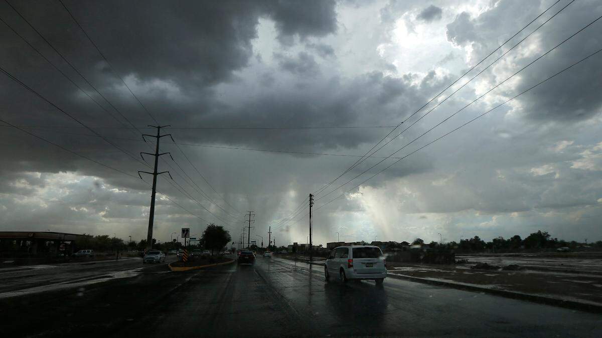 In this file photo, monsoon storms move into the metro area as the dark clouds release heavy rains Wednesday, July 11, 2018, in Phoenix. Photo by Ross D. Franklin/AP