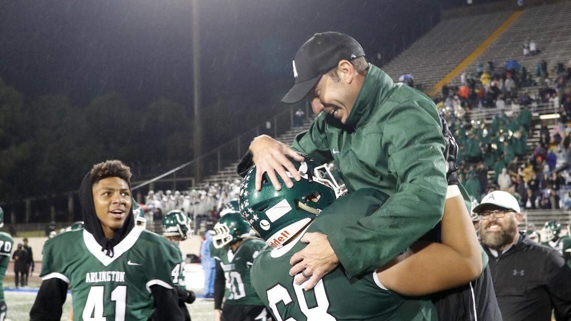 Arlington offensive lineman Max Castillo (68) lifts Arlington head coach Scott Peach into the air after their win of a high school football game at Maverick Stadium in Arlington, Texas, Thursday,  Nov. 08, 2018. Arlington secured the District 4-6A with a 42-31 defeat of Arlington Lamar. (Special to the Star-Telegram Bob Booth)

