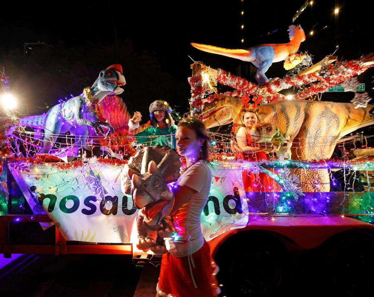 The float from Dinosaur Land passes during the 2024 Parade of Lights in Fort Worth.