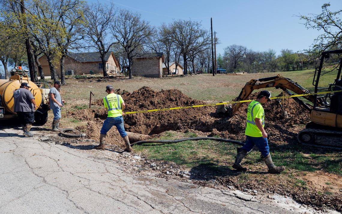 Runaway Bay public works employees work to replace a section of broken clay pipe after a clogged sewer line on Tuesday, March 25, 2025, after they responded to a clogged sewer line call. Runaway Bay has an outdated sewer system that threatens to spill sewage into Lake Bridgeport.
