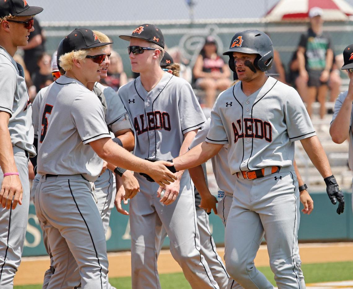 Aledo third baseman Blake Burdine (6) is welcomed back to the dugout after scoring the games first run during the UIL baseball regional final 5A D1 playoff game at Hawk Baseball Field in North Richland Hills, Texas, Thursday, May 22, 2025.