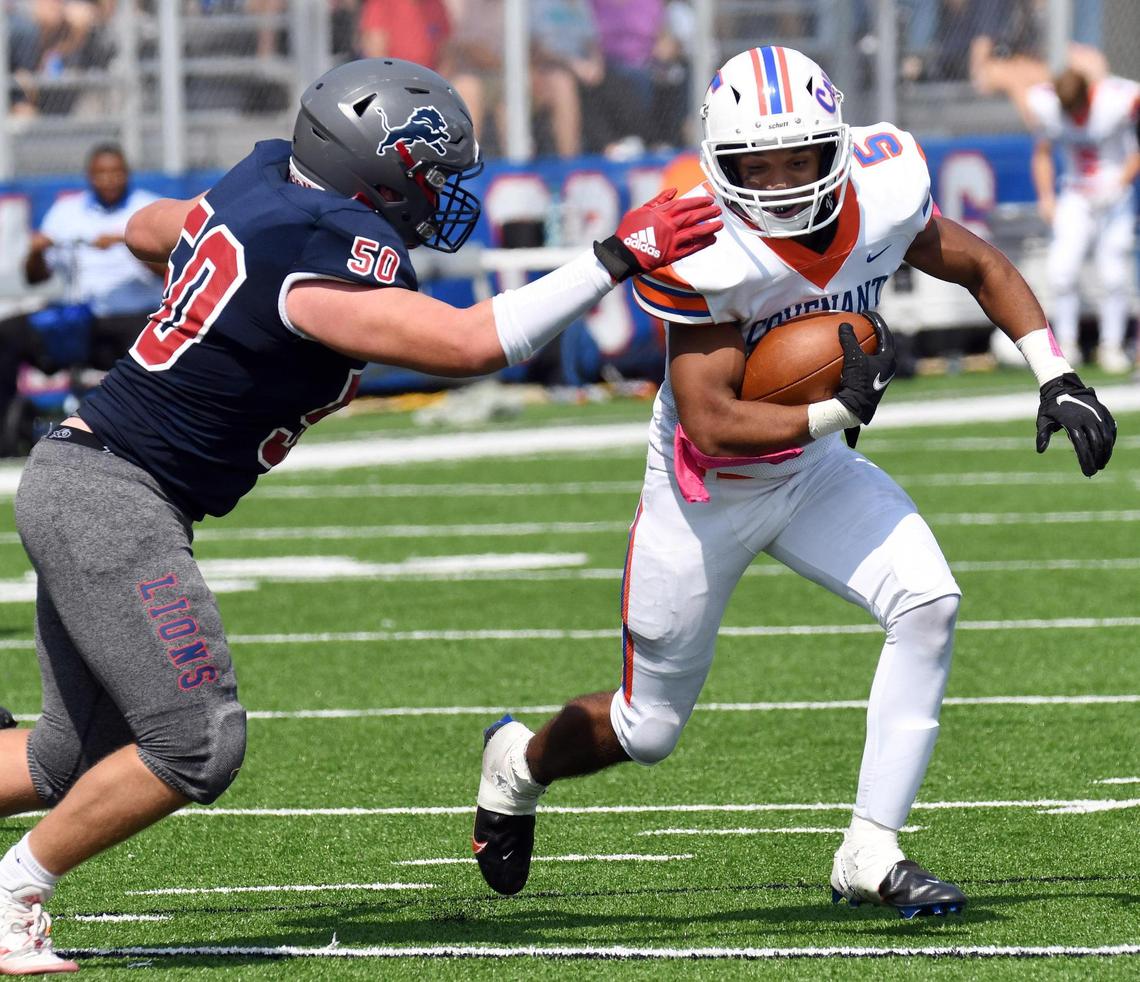 Colleyville Covenant’s Isaiah Swift, right, tries to elude Lubbock Trinity’s Hunter Mastin as he rushes near the goal line during the third quarter of their TAPPS Division 3 District 1 football game Saturday, October 3, 2020 in Colleyville, Texas. Covenant won 21-20. Special/Bob Haynes