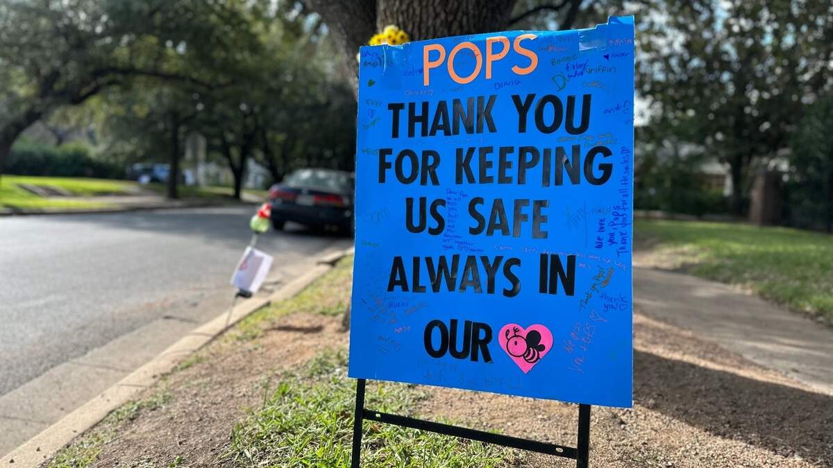 A sign outside Lily B. Clayton Elementary in Fort Worth in memory of crossing guard Mark Knowles.