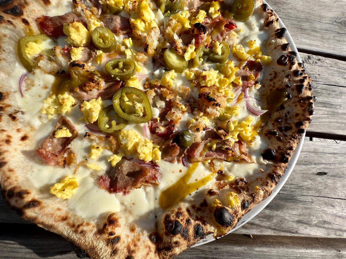 A “breakfast taco pizza” on the brunch menu at Cane Rosso.