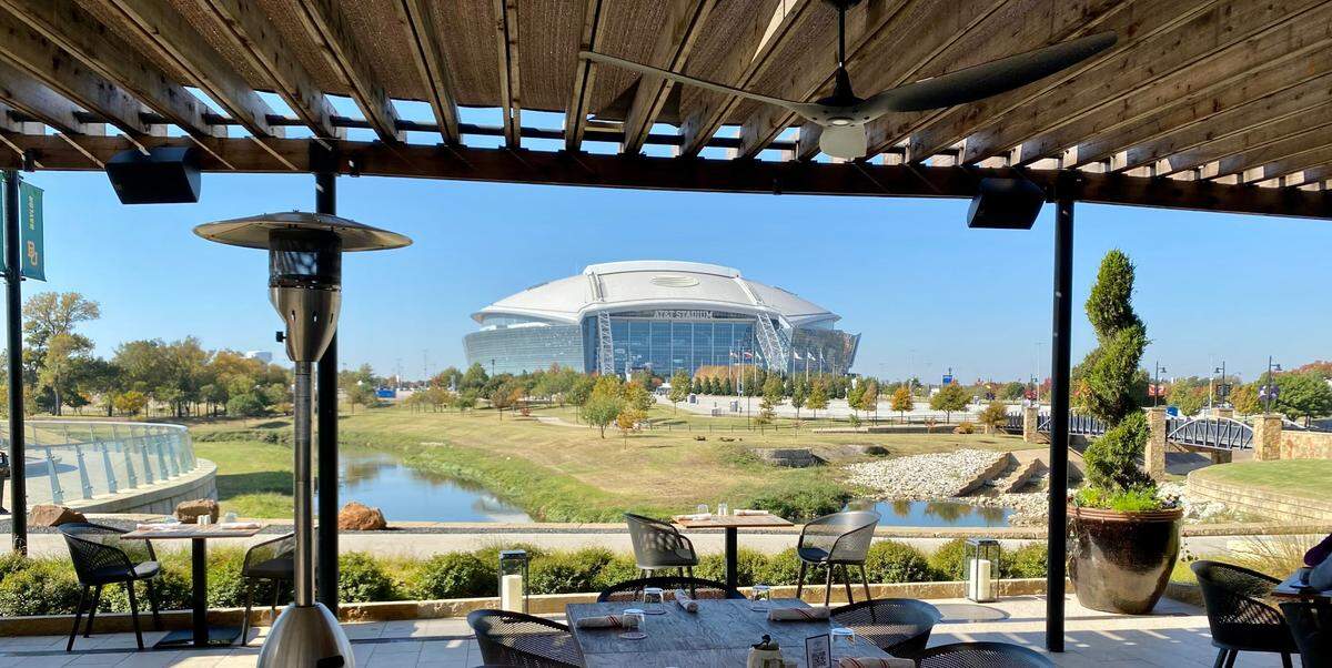 Cut & Bourbon’s sprawling, heated patio in Arlington has plenty of room for gatherings.