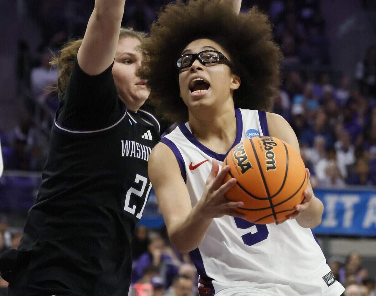TCU guard Olivia Miles (5) gets a shot off defended by Washington forward Brynn McGaughy (21) during the first half of a second round NCAA Division I Women's Basketball Championship game at Schollmeier Arena in Fort Worth, Texas, Sunday, March, 22, 2026.