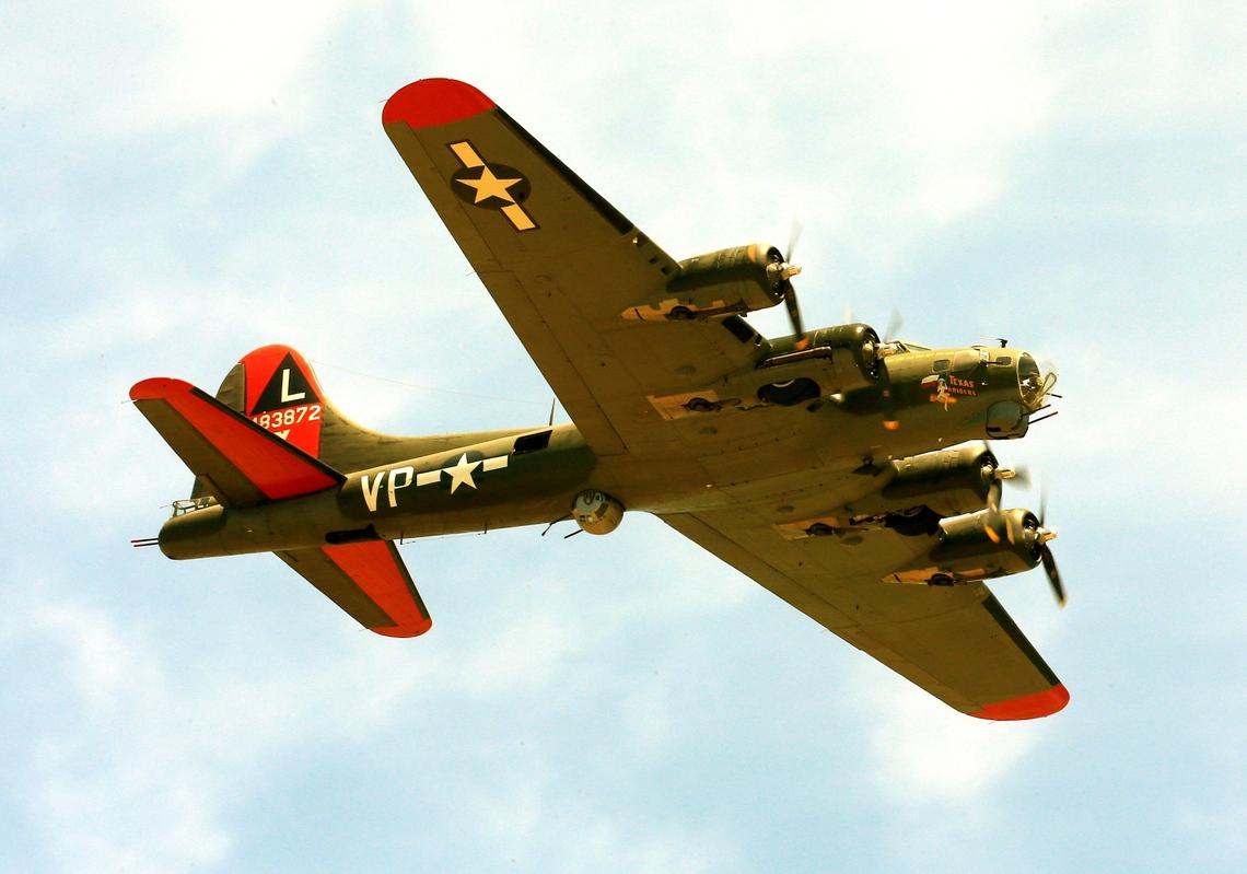 FILE - The historic military B-17 aircraft named “Texas Raiders” flies over Barksdale A.F.B., La., on May 8, 2021. On Saturday, Nov. 12, 2022, the plane collided with another during the Commemorative Air Force Wings Over Dallas air show.