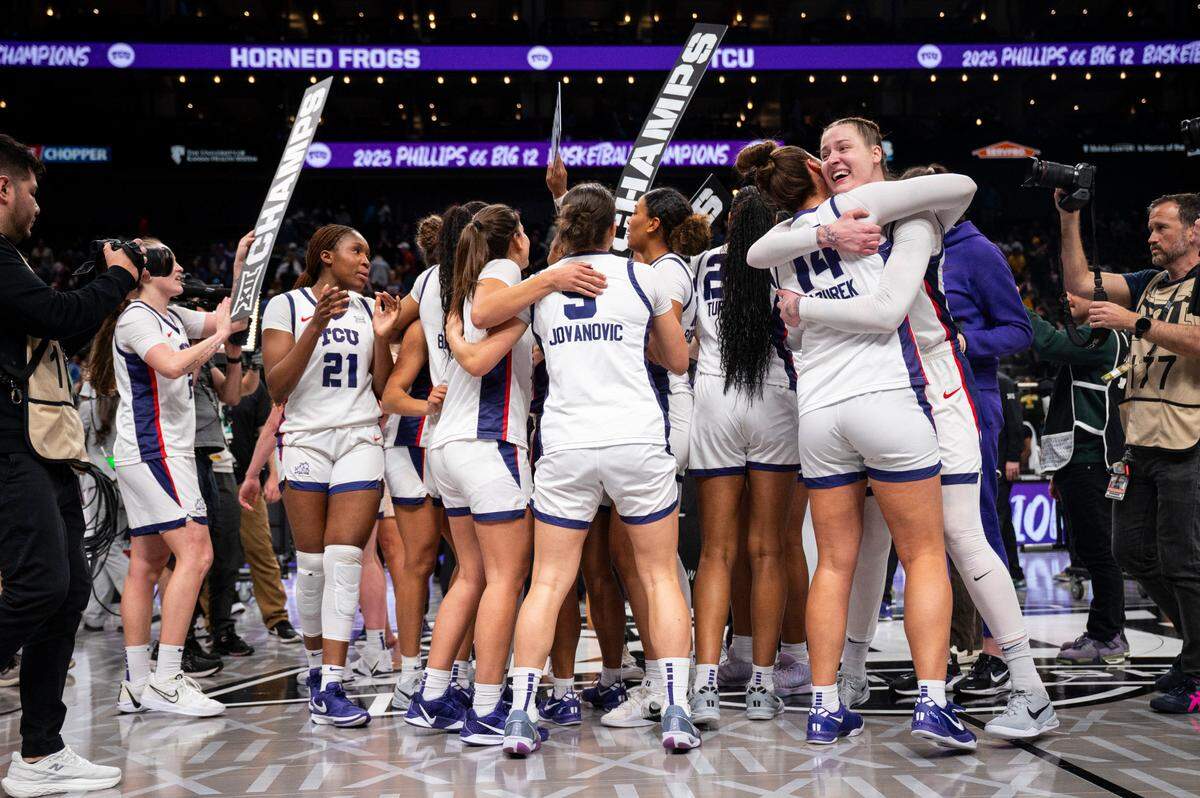TCU Horned Frogs players celebrate after defeating the Baylor Lady Bears at T-Mobile Center on March 9, 2025, in Kansas City.