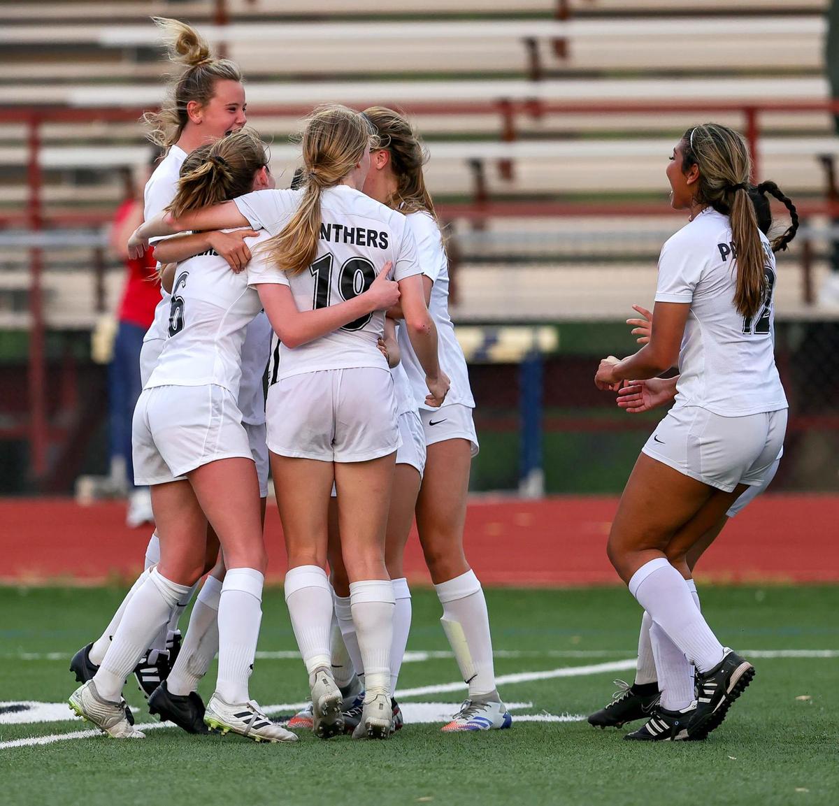 Colleyville Heritage celebrate their overtime victory against Burleson, 4-3 in the 5A Region 1 area round girls soccer playoffs played on March 30 2021, at Cravens Field in Arlington, TX. (Steve Nurenberg Special to the Star-Telegram)