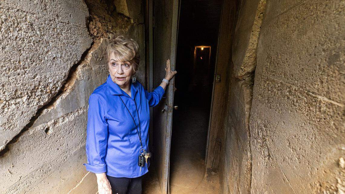 Curator and historian Vickie Bryant opens the door to one of the multiple escape tunnels coming out of the former Top O’ Hill Terrace casino and speakeasy in July.