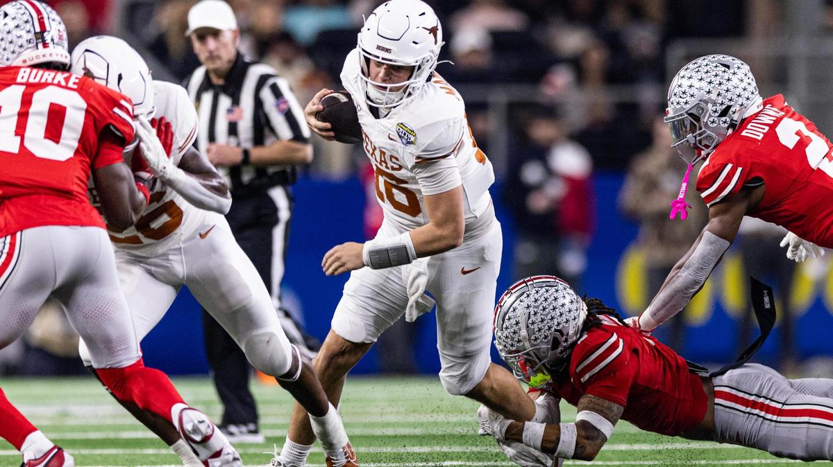 Texas back up quarterback Arch Manning (16) rushes for a first down in the second quarter of the College Football Playoff semifinal game between Ohio State and Texas at AT&T Stadium in Arlington on Friday, Jan. 10, 2025.