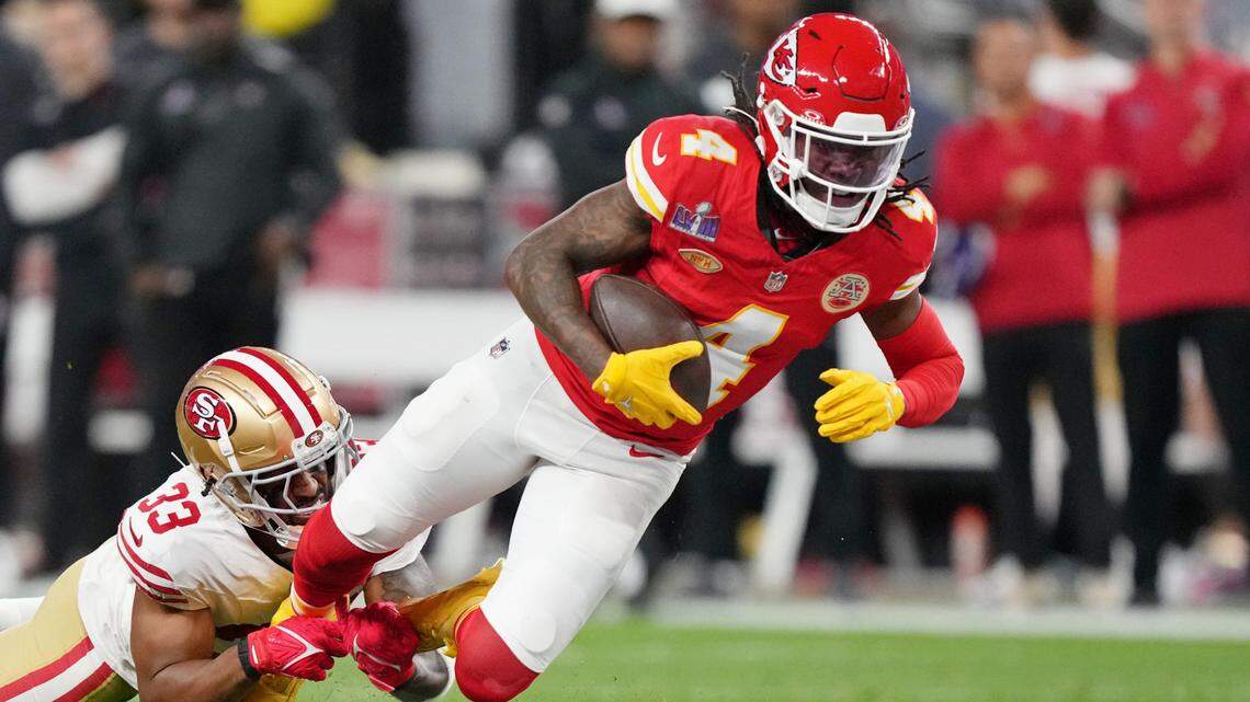 San Francisco 49ers safety Logan Ryan (33) tackles Kansas City Chiefs wide receiver Rashee Rice (4) during the second quarter of Super Bowl LVIII at Allegiant Stadium.