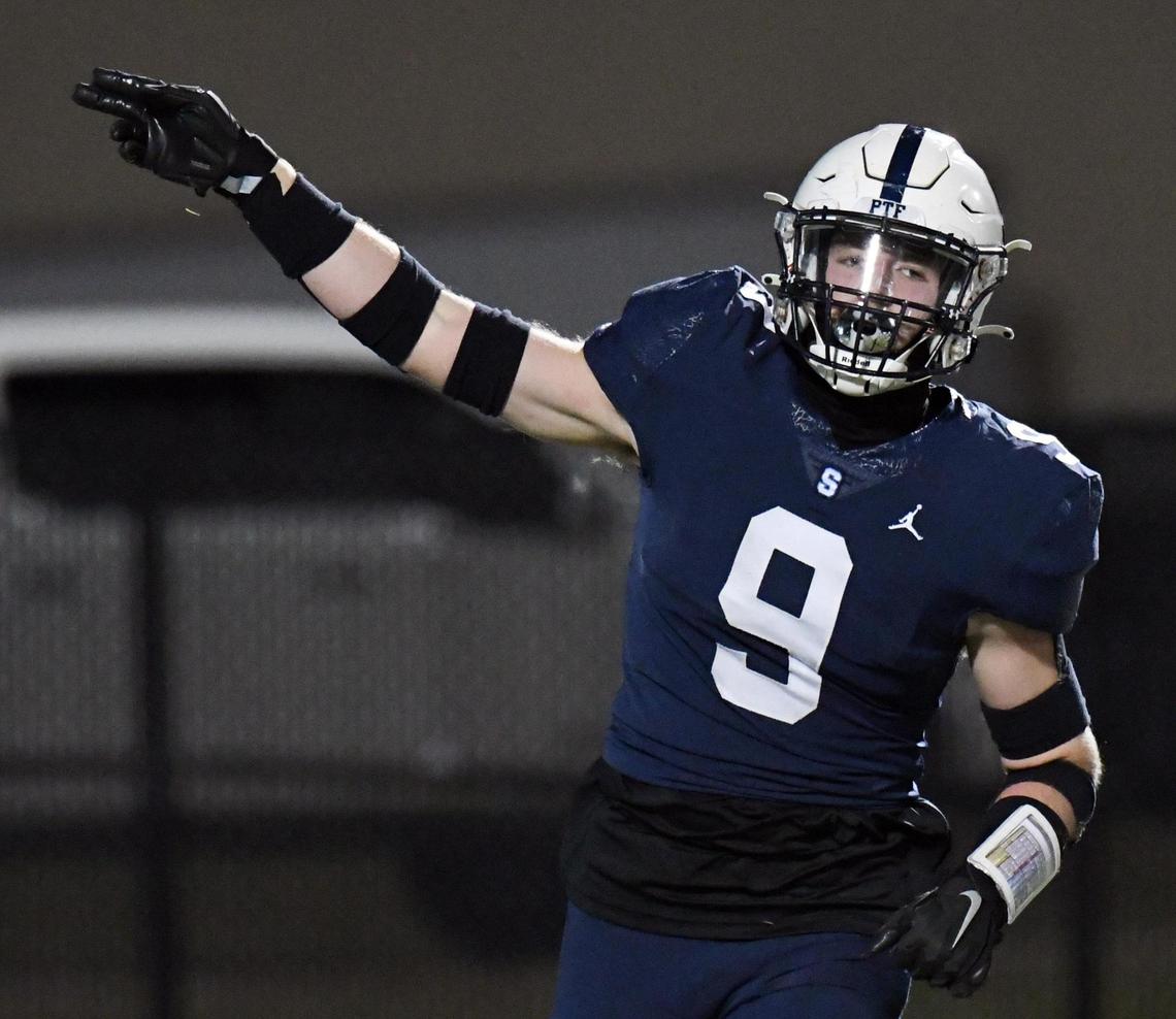 All Saints’ Robert Sanders indicates the Saints’ football after an interception of a Liberty Christian pass during the second quarter of Friday’s November 18, 2022 TAPPS Division 2 Regional Championship football game at the Birdville Fine Arts Athletics Complex in North Richland Hills, Texas. All Saints won 37-20. Special/Bob Haynes