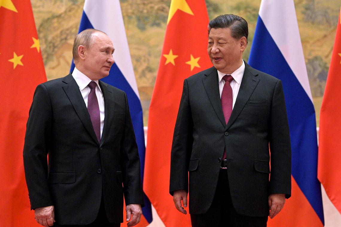 FILE - Chinese President Xi Jinping, right, and Russian President Vladimir Putin talk during their meeting in Beijing, China, Friday, Feb. 4, 2022. With Russia’s military failings in Ukraine mounting, no country is paying closer attention than China to how a smaller, outgunned force has badly bloodied what was thought to be one of the world’s strongest armies. (Alexei Druzhinin, Sputnik, Kremlin Pool Photo via AP, File)