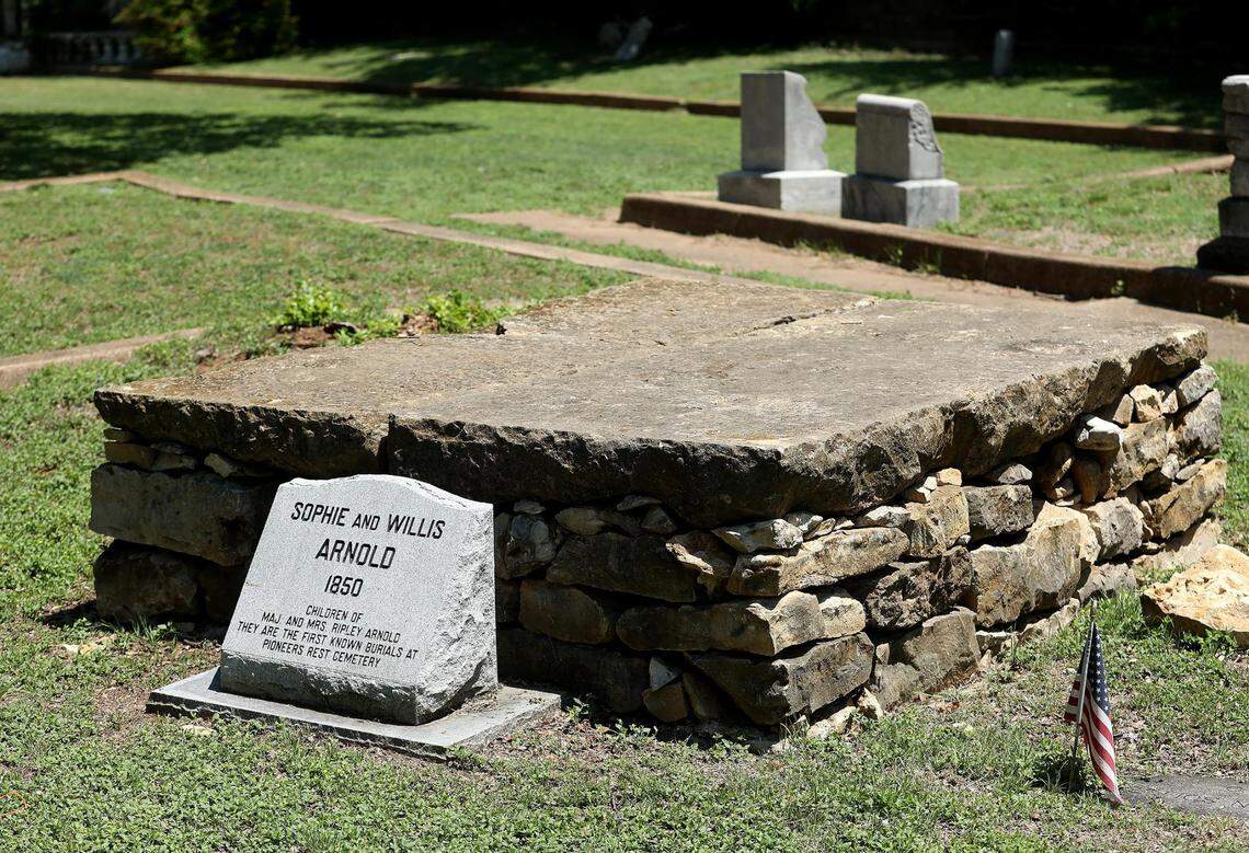The grave of Sophie and Willis Arnold at Pioneers Rest Cemetery, one of Fort Worth’s oldest cemeteries, on Friday, May 6, 2022. The two children were the first known burials on the land in 1850.