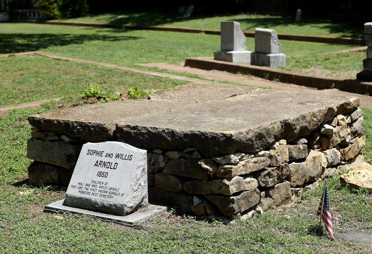The grave of Sophie and Willis Arnold at Pioneers Rest Cemetery, one of Fort Worth’s oldest cemeteries, on Friday, May 6, 2022. The two children were the first known burials on the land in 1850.