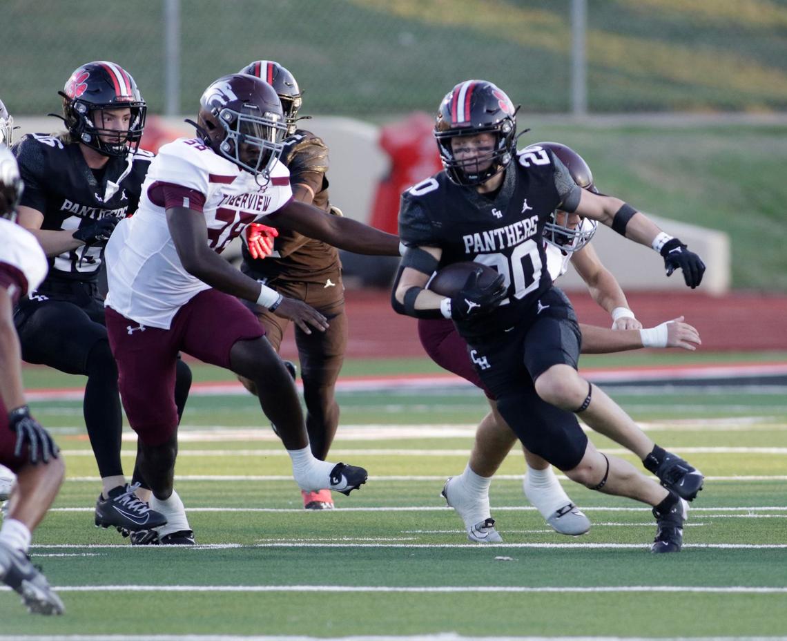 Colleyville Heritage’s Bryson Burgess looks for running room during a UIL football game at Mustang-Panther Stadium on Friday, Sept. 20, 2024.