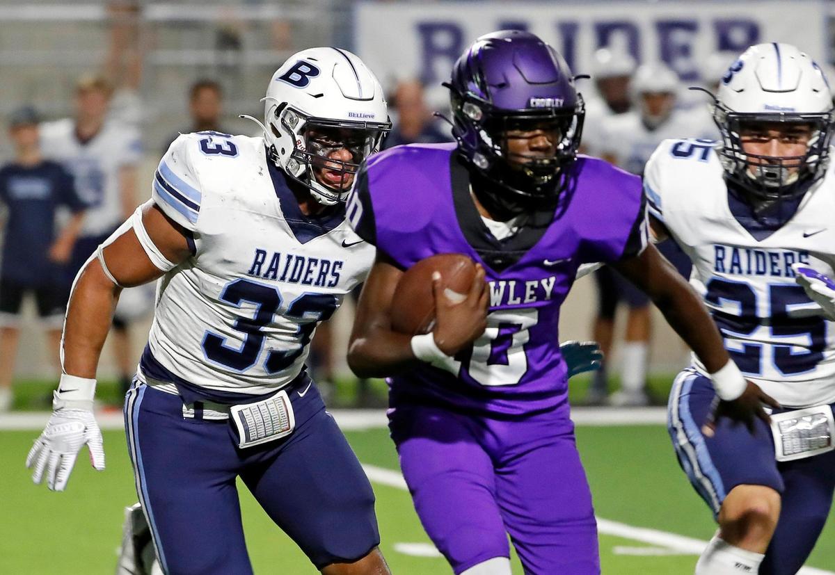L.D. Bell inside linebacker Trey Wilson (33) chases down Crowley quarterback Caleb Williams (10) with help from outside linebacker Zander Canales (25) in the backfield in the first half of a high school football game at Crowley ISD Multipurpose Stadium in Crowley Texas, Friday, Sept. 23, 2022. L.D. Bell led Crowley 14-10 at the half. (Special to the Star-Telegram Bob Booth)