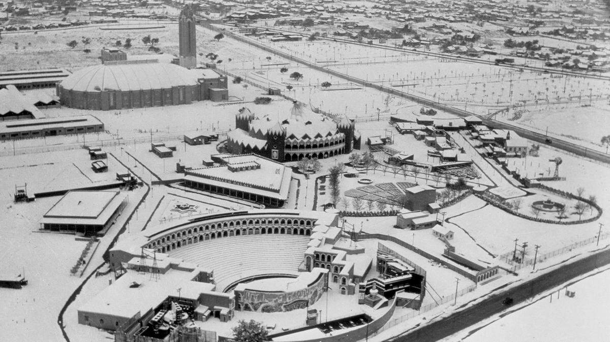 A view of the recently completed Will Rogers Memorial Coliseum and Frontier Fiesta grounds covered in snow, circa 1937.