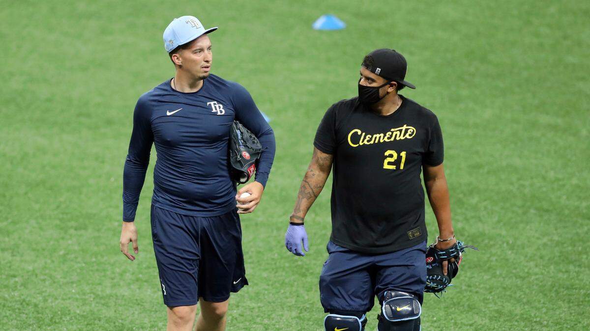 Tampa Bay Rays bullpen catcher Jean Ramirez, right, talks with pitcher Blake Snell before a game in July 2020. Ramirez, 28, who played at Boswell and lived in Saginaw, was found dead of suicide near his family’s home on Monday.