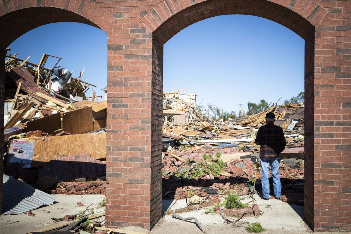 A parishioner looks over the damage after a tornado Monday, Oct. 21, 2019, at Primera Iglesia Bautista de Dallas in Northwest Dallas.