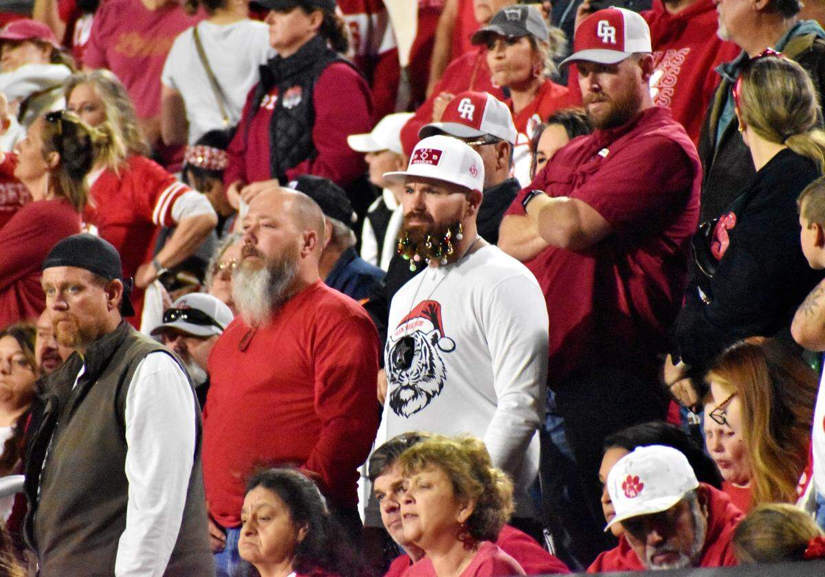 Glen Rose fans stand stoically after a kickoff return for a touchdown by Gilmer during Friday’s playoff game in Prosper on Dec. 9, 2023.