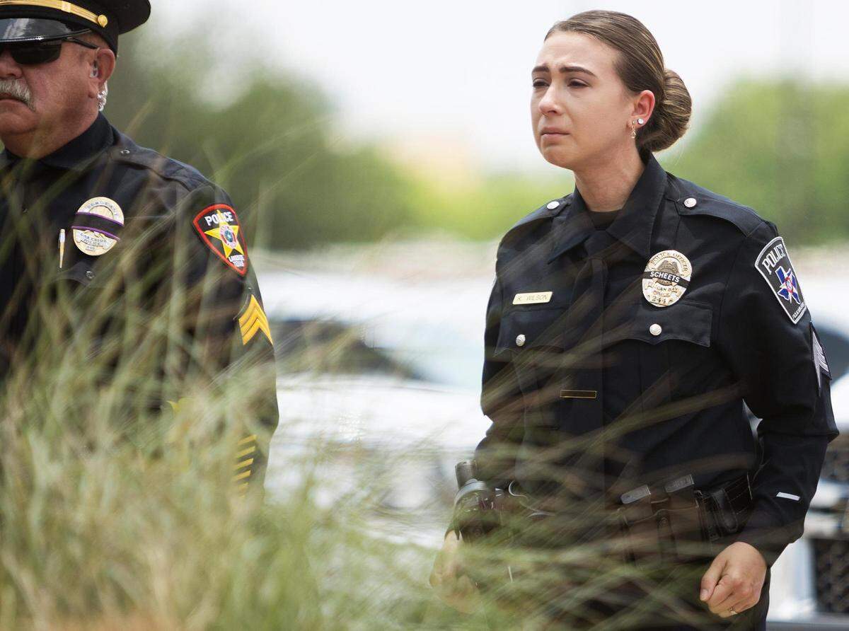 Tarrant County sheriff’s deputies stand at attention during fellow Tarrant County Deputy Billy W. Scheets’ funeral on Thursday in Fort Worth. Scheets, who had been a member of the Tarrant County Sheriff’s Office for 19 years, died while answering a call on Sunday.