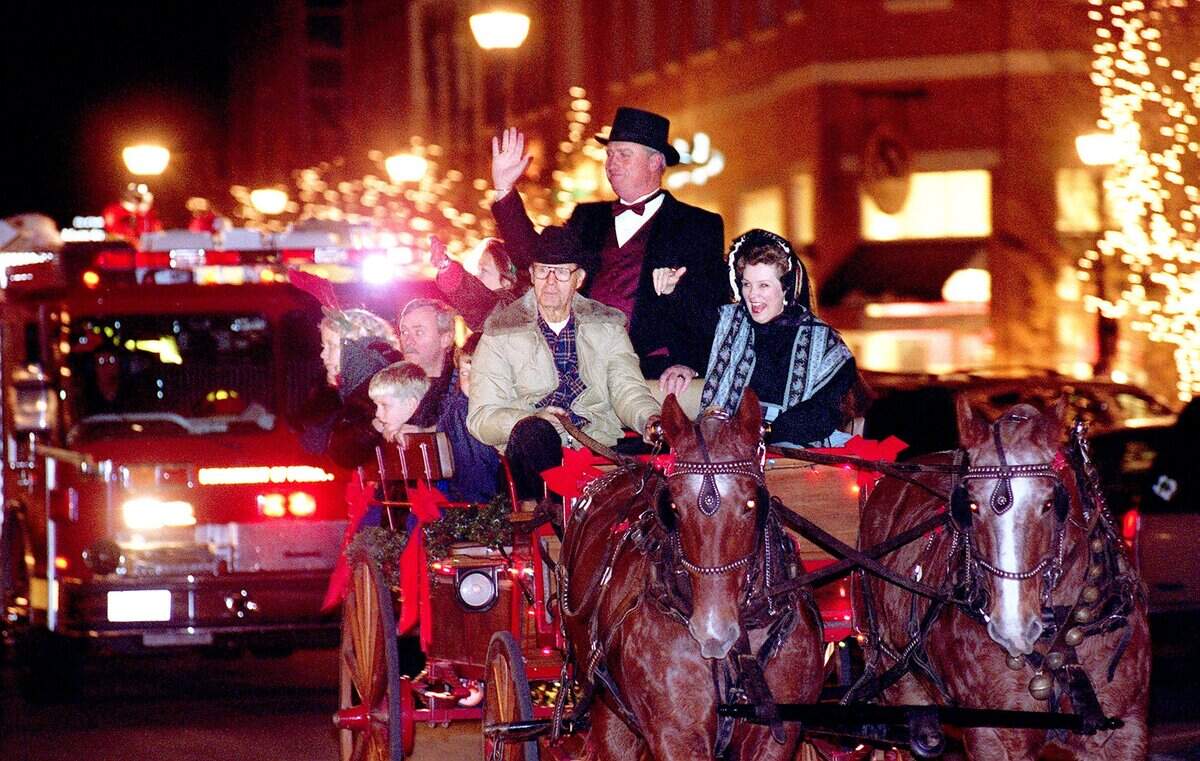 Dec. 4, 1999: Mayor Rick Stacy and other members of the city council lead the way for Santa Claus, in a fire truck, at 'Holiday in the Park' at Southlake's Town Square.