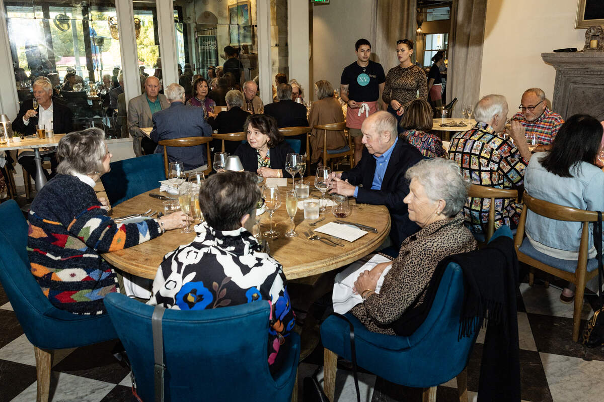 Event attendees speak with each other at the Eats Beat Dinner with Bud at Quince in Fort Worth on Tuesday, Oct. 28, 2025.