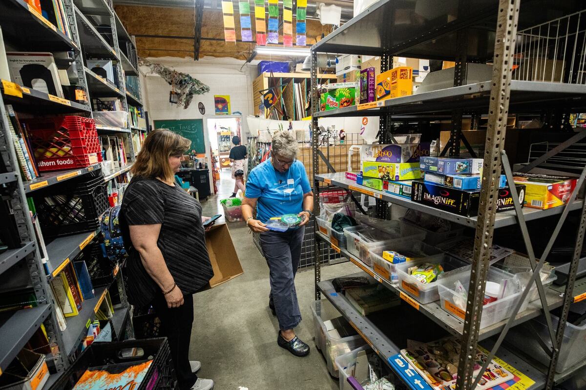Sherry Clemmons, a teacher for students who are visually impaired, left, and The Welman Project volunteer Wendie Lunsford look through the aisles on Tuesday in Fort Worth. Clemmons attended the “create something” class, an event the organization held in the morning.