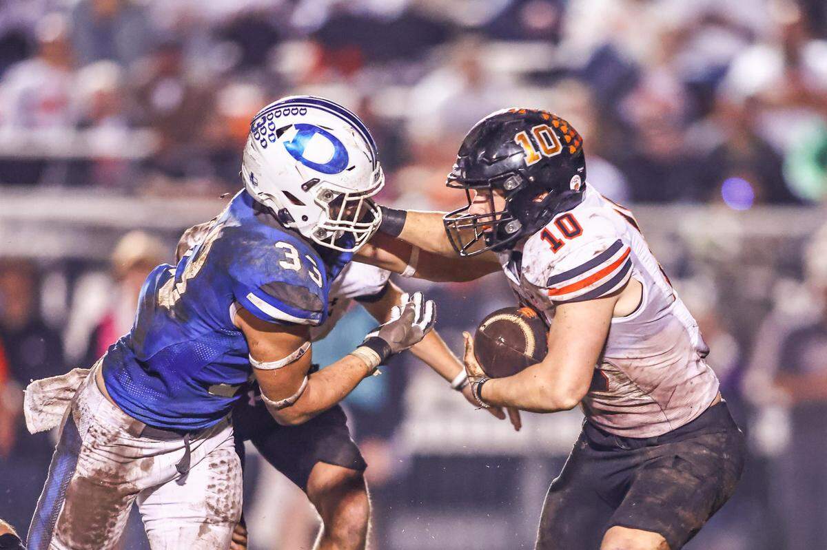Decatur’s Michael Trammell stops Springtown’s Ryan Kirk for a loss in the Friday, Nov. 1 game at Decatur. Special to the Star-Telegram / Tom Marvin