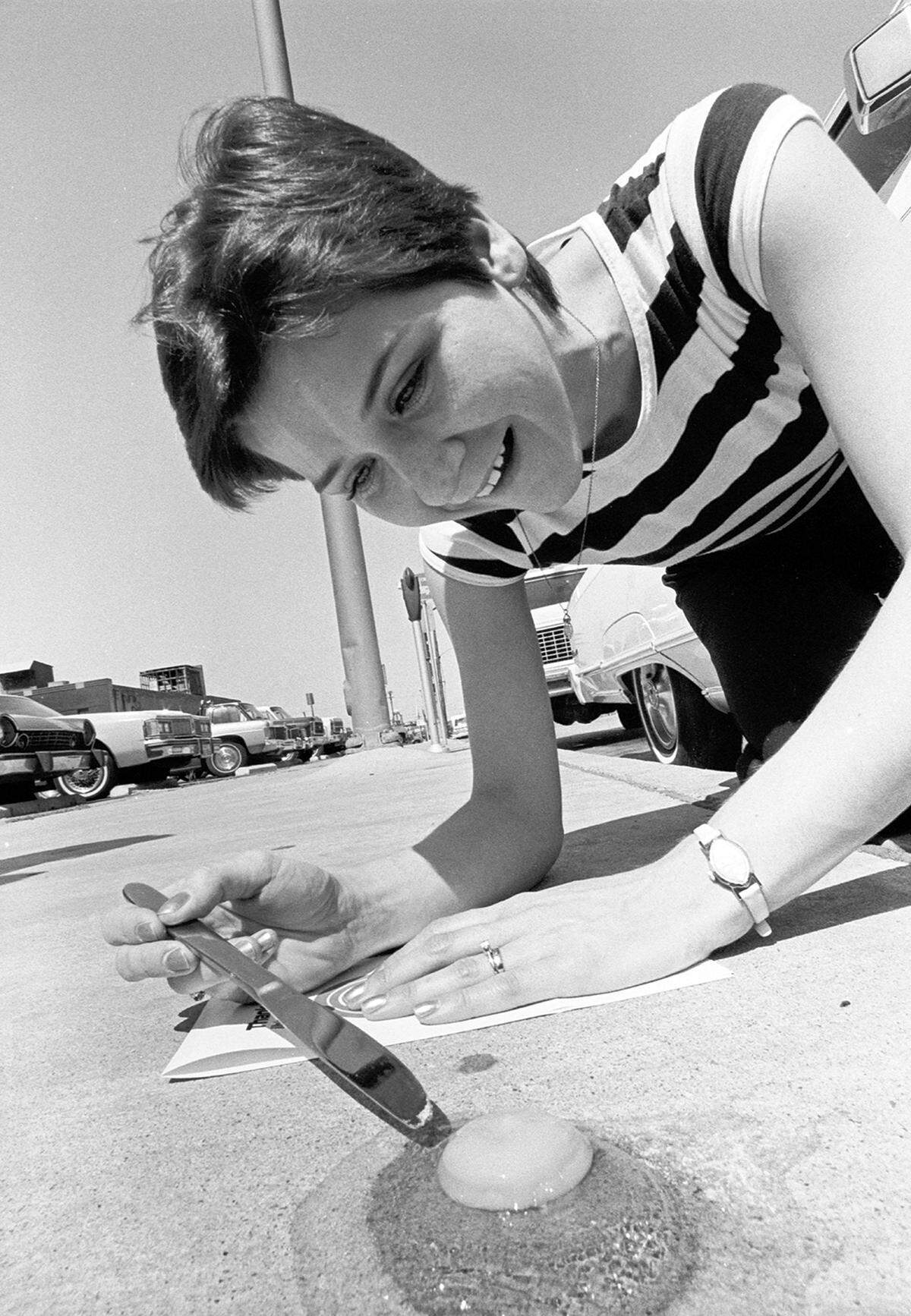 June 26, 1980: A woman fries an egg on a concrete sidewalk in Fort Worth as temperatures 110 degrees during a heat wave.