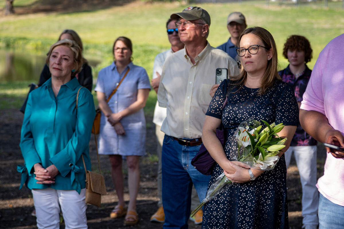 Family members and friends gather at a memorial dedication for Meg and Ben Arbour in the Summer Creek Ranch neighborhood of Fort Worth on Wednesday, May 3, 2023. The couple was killed in a car accident caused by two vehicles racing at night in November 2020.