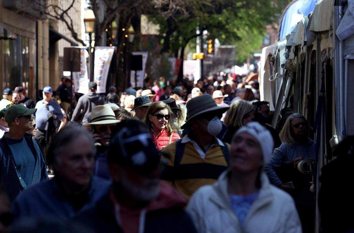 Visitors to the Main Street Arts Festival crowd Main Street in downtown Fort Worth on Friday. The Fort Worth Art Fair was also taking place at Sundance Square Plaza.