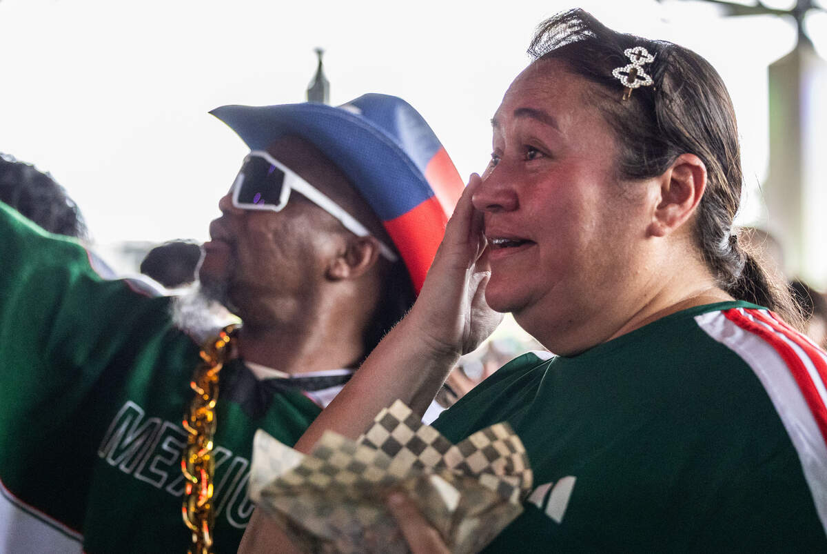 Martha De Santiago wipes tears from her eyes while singing Mexico's national anthem during the FIFA Fan Festival on Thursday, June 11, 2026, at Fair Park in Dallas. Mexico has never won the FIFA World Cup.