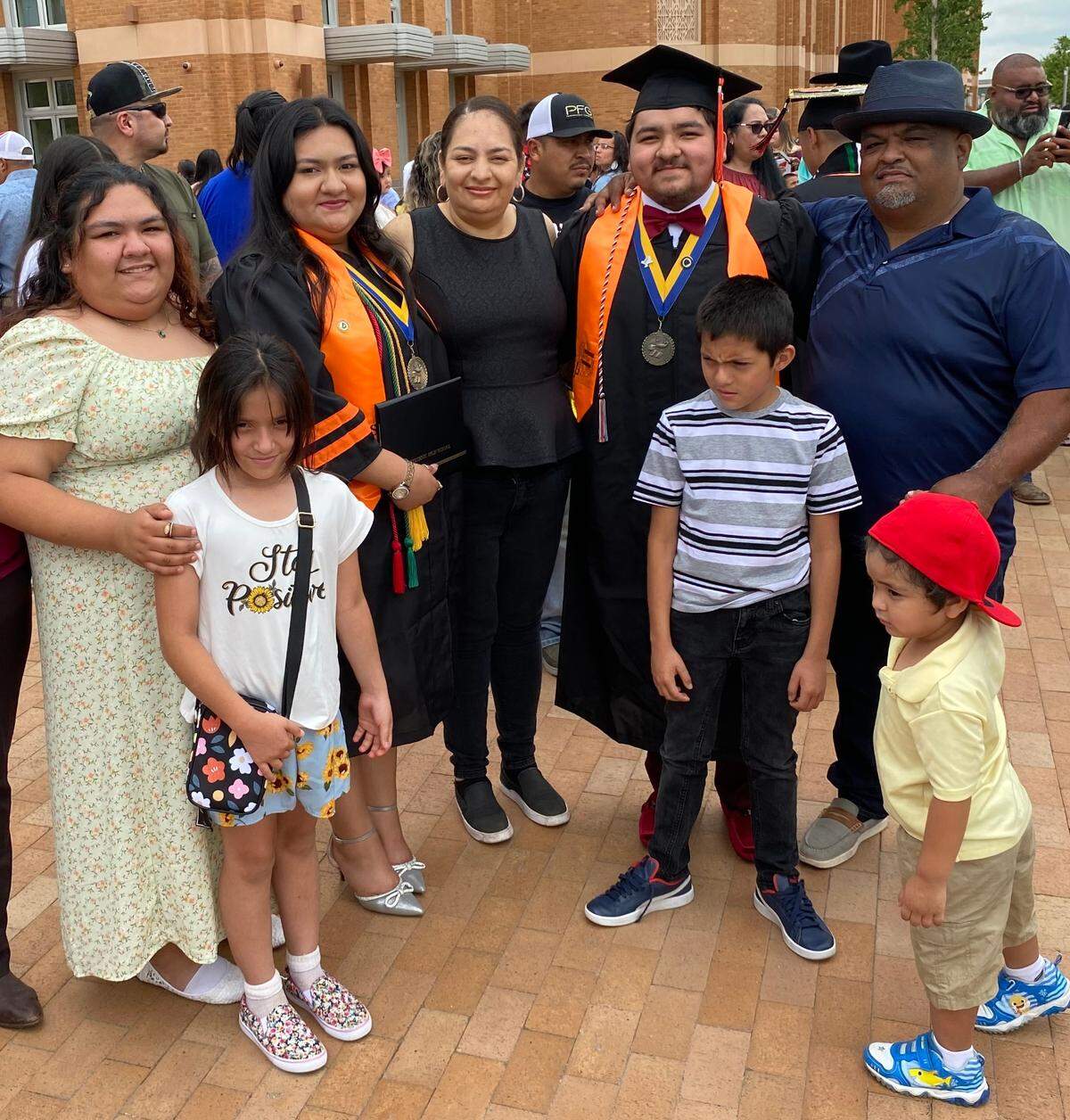 Rudy Rodriguez, father of 7, is celebrating his kid’s graduation ceremony with his wife Maria and his kids Alex , Cassi , Rudy , Manny , Mary , and baby Noah .