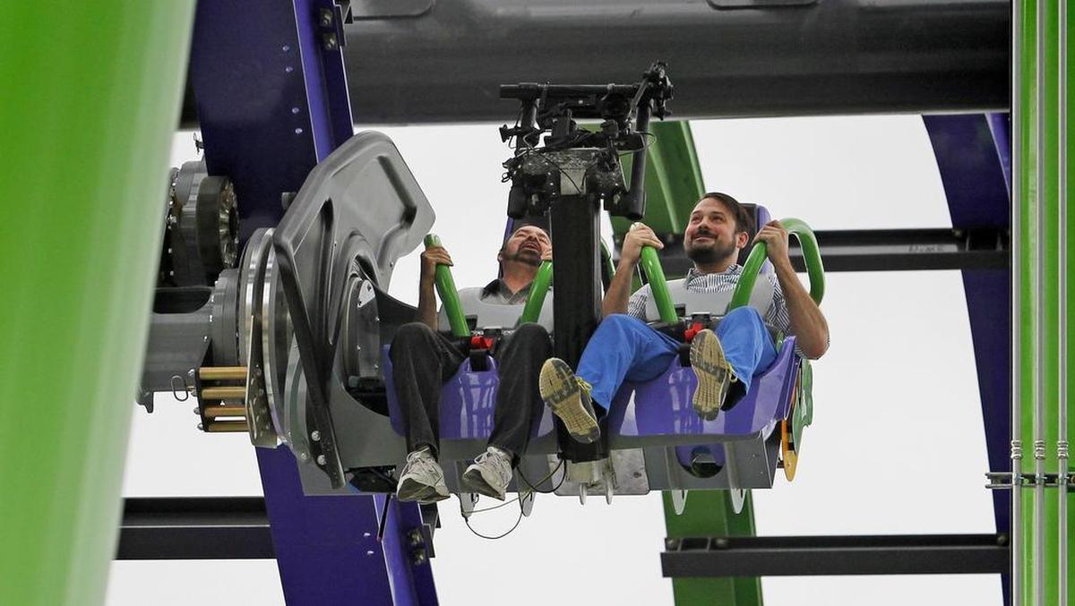 Tim Baldwin (l, Editor of Roller Coaster Magazine and communications director of American Coaster Enthusiasts) and Star-Telegram reporter Matt Martinez (r) in their seats on The Joker. Six Flags in Arlington unveiled its new coaster ride, The Joker, in the Gotham City area of the park, Tuesday, May 16, 2017.
