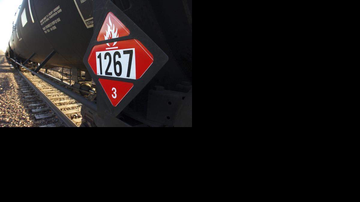 
A crude oil tank car displays a a warning placard. Railroads want to keep the train routes secret.


