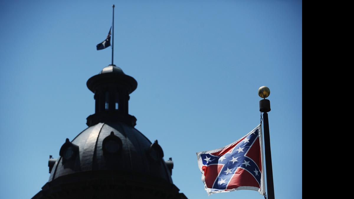 
South Carolina Gov. Nikki Haley says the state should stop flying the Confederate flag near the statehouse, in Columbia, S.C. 
